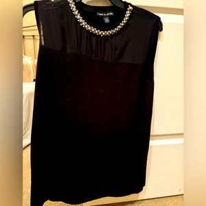 Pearl neck blouse.